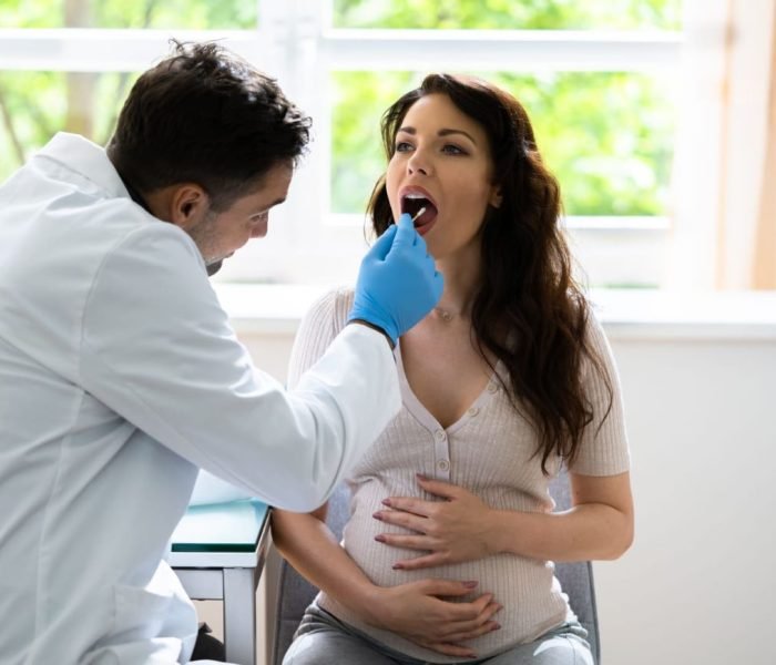 DNA Testing Toronto | Ancestry, Paternity & Health | Medica Laser Spa 3 Close-up of a woman undergoing DNA testing with a mouth swab