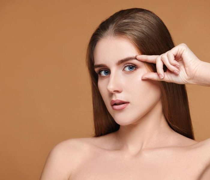 Close-up of a woman with clear skin, representing the results of laser face rejuvenation.